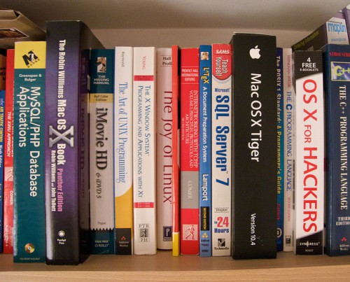 A few of the geeky books on the shelving in my study.